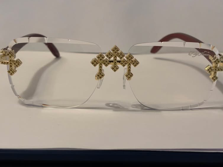 RayStance Halo — clear rimless frame with gold cross accents, front view